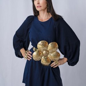 woman wearing blue dress and brass belt