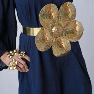 woman wearing blue dress and brass belt
