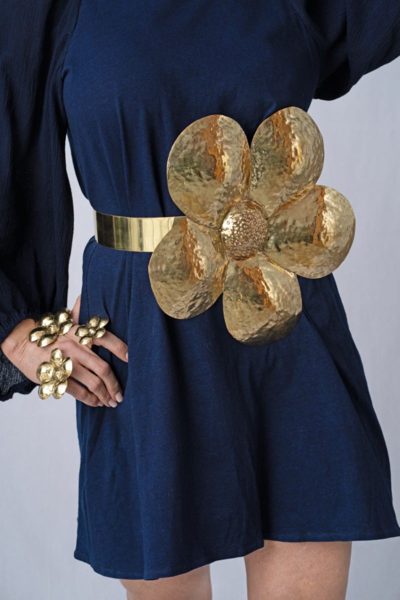 woman wearing blue dress and brass belt